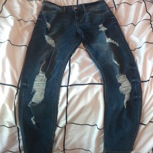 Never worn jeans with holes through both legs